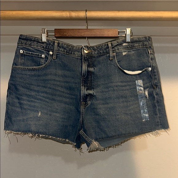 free assembly Pants - Distressed Blue Jean Shorts with Raw Hem